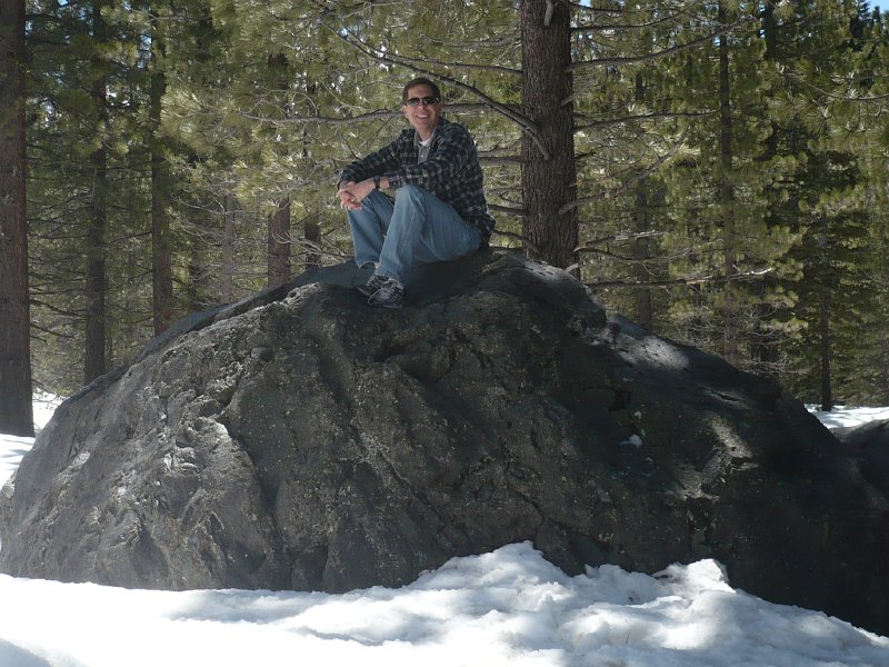 David climbed the snow bank to sit on Hot Rock