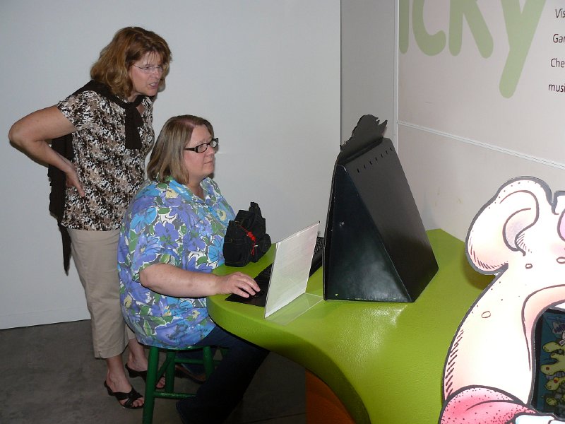 Bev Stupek (Development Director @ Turtle Bay) and Lyn play a computer game @ Grossology Exhibit